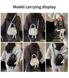 Mini borse a tracolla beige e nere con ciondolo a cuore di perle e nastro a pois elegante