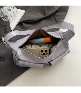 Deep interior view of lavender crossbody bag showing storage capacity for phone and cosmetics