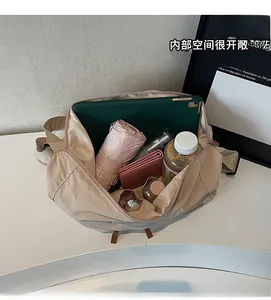 Interior view showing large capacity of beige canvas tote bag with various daily essentials