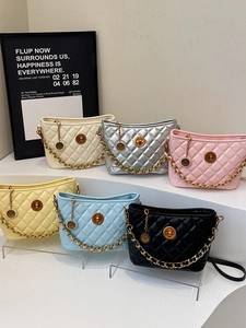Chic quilted tote bags with gold chain straps shown in six vibrant fashion colors