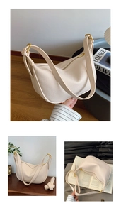Detail of cream hobo bag with pebble leather texture and golden metal buckle accents