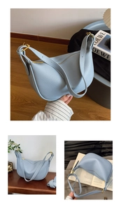 Close-up of light blue litchi pattern leather and golden metal hardware on handbag