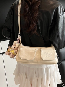 Cream underarm shoulder bag with double flap pockets and cute bear charm pendant