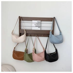 Showcase of six colorful hobo shoulder bags with textured lychee grain and adjustable straps