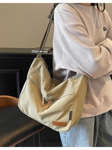 Large khaki nylon messenger bag for students with minimalist Japanese crossbody design