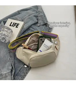 Spacious interior of beige chest bag with patterned strap for phone and cosmetics