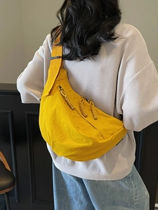 Fashionable ginger yellow nylon half-moon crossbody bag with woven zipper pullers
