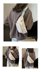Detail of cream nylon crossbody bag with multi-zipper pockets and jacquard strap