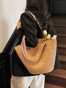 Handwoven straw tote bag with colorful geometric strap and large capacity for beach