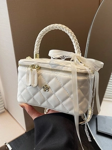Elegant white quilted box bag with floral charm and lace ribbon handle for women