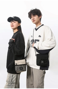 Detail of functional techwear crossbody bags with mesh pockets and durable nylon fabric