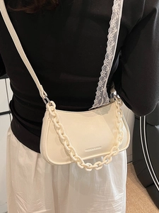 Chic cream white crossbody dumpling bag with plastic chain strap for stylish women