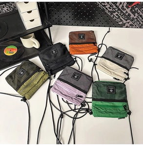 Detailed view of functional nylon crossbody bags in six vibrant colors and mesh layers