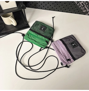 Detail of vibrant green and light purple tactical nylon bags with mesh pockets