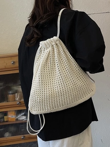 Chic cream hollow crochet drawstring backpack for women in a stylish summer aesthetic