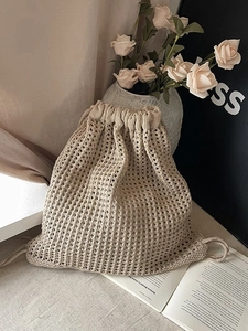 Hollow out knitted bucket backpack in beige with drawstring closure for summer