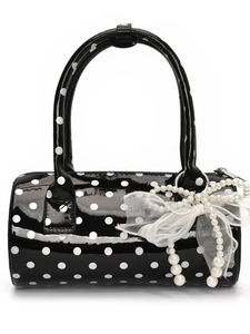 Chic black and white polka dot cylindrical handbag with pearl lace bow detail