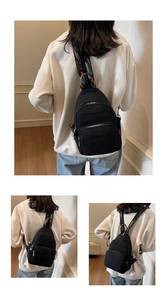 Detail of black nylon multi-way chest bag featuring colorful geometric woven shoulder strap