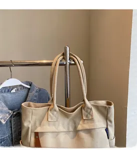 Detail of durable canvas tote bag with wide straps and high-quality stitching