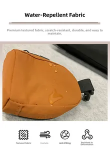 Close-up of waterproof fabric on orange mini shoulder bag showing water drop resistance