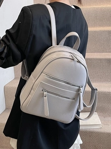 Fashionable light grey lychee leather backpack for women with dual front zipper pockets