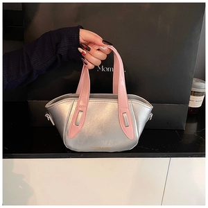 Close-up of mini silver bucket bag with pink handles and Fashion & Bags text logo