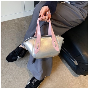 Detail of silver metallic bucket bag with pink handles and Fashion & Bags text