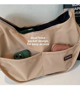 Macro view of nylon tote bag with double front pocket design for easy storage