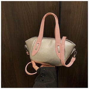 Detail of silver metallic bucket bag with pink handles and Fashion & Bags printed text