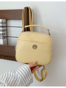 Versatile light yellow PU leather square bag with top handle and adjustable shoulder strap