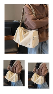 Detailed macro view of the cream nylon crossbody bag featuring SJCHAO lettered strap