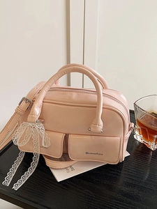 Pink PU patent leather crossbody bag with lace bows and double front pockets