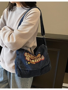 Denim shoulder bag with Lookin Good embroidery and stars in a retro streetwear style