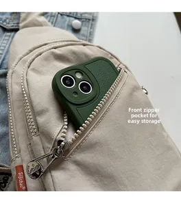 Detail of beige nylon crossbody bag featuring a front zipper pocket for smartphone storage