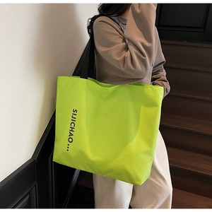 Fluorescent green large tote bag with black letter print on a high-quality nylon fabric