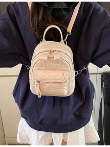 Chic quilted mini backpack in cream PU leather with heart stitching and metal zipper
