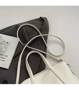 Detailed macro view of comfortable leather shoulder strap and lychee grain texture