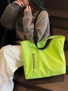 Neon green large capacity tote bag with black letter print and durable strap handles