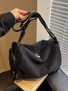 Large black nylon crossbody bag with chic jacquard strap and stylish side zipper detail