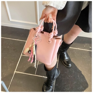 Pink PU leather bucket bag detail with heart buckle and stylish charms