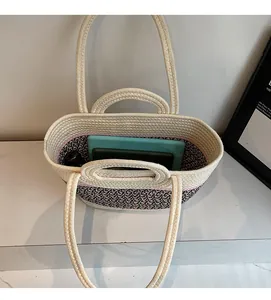Macro view of woven tote interior with spacious storage and contrast knit textures