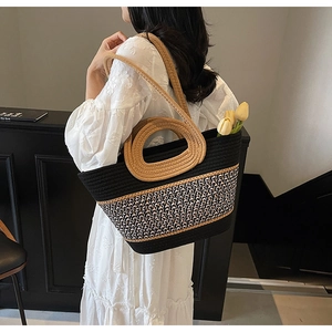 Detail of bohemian woven tote bag with contrast diamond pattern and sturdy rope handles