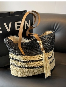 Retro oversized woven tote bag with black and white stripes and brown leather straps