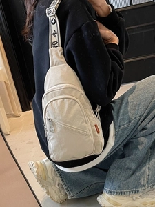 Off-white nylon chest bag for women with wide jacquard strap and multiple zip pockets