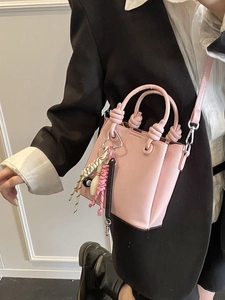 Pink leather bucket bag with billiard 8 charm and knot handle for women's daily commute
