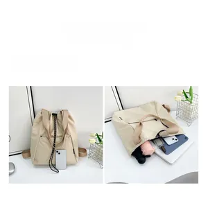 Detail view of large capacity beige canvas backpack with organized interior compartments