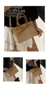 Detail of khaki woven bucket bag with brown leather handles and adjustable shoulder strap