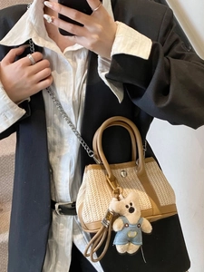 Mini woven straw beach bag with brown leather trim and cute bear charm pendant