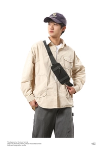 Close-up of black tactical nylon sling bag showing durable fabric and zipper details