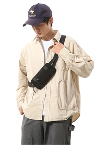 Close-up of black waterproof nylon crossbody waist bag with zipper and wide strap